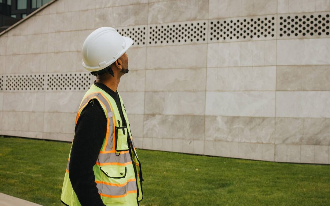 Sevana Consulting civil engineer reviewing structural drawings on a Western Canada construction site